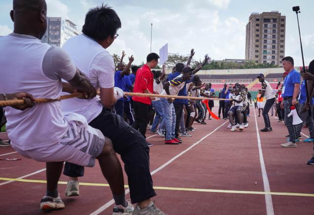 (251205) -- NAIROBI, Dec. 5, 2025 (Xinhua) -- Participants compete in the tug-of-war at the China-Kenya Friendship Games in Nairobi, Kenya, on Dec. 4, 2025. The inaugural China-Kenya Friendship Games took place on Thursday in Nairobi, the capital of Kenya, as part of efforts to strengthen bilateral ties.
The day-long competition saw over 700 Chinese and Kenyan attendants from 19 Chinese companies who are members of the Kenya-China Economic and Trade Association (KCETA), featuring track and field events, as well as fun games. (Xinhua/Han Xu)