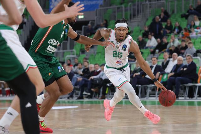 (251205) -- LJUBLJANA, Dec. 5, 2025 (Xinhua) -- Kadre Gray (R) of Slask Wroclaw dribbles the ball during the BKT EuroCup Basket 2025/26 regular season round 9 match between Cedevita Olimpija Ljubljana and Slask Wroclaw in Ljubljana, Slovenia, on Dec. 4, 2025. (Photo by Zeljko Stevanic/Xinhua)