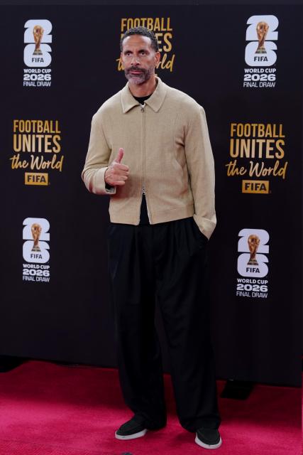 (251205) -- WASHINGTON, D.C., Dec. 5, 2025 (Xinhua) -- English former football player Rio Ferdinand arrives for the welcome reception ahead of the final draw for the 2026 FIFA World Cup at John F. Kennedy Center for the Performing Arts in Washington, D.C., the United States, on Dec. 4, 2025. (Xinhua/Jia Haocheng)