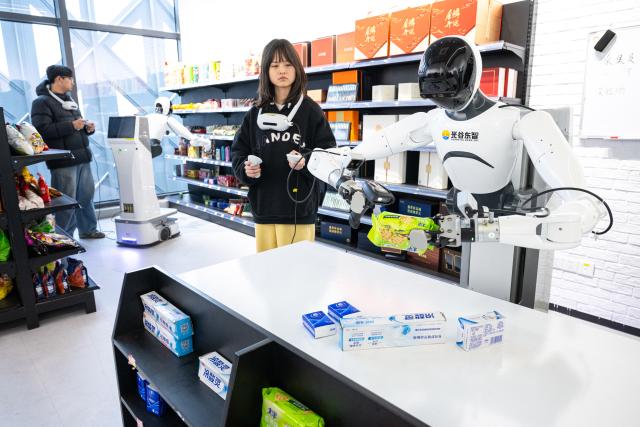 (251205) -- WUHAN, Dec. 5, 2025 (Xinhua) -- A staff member operates a robot to collect data in a supermarket scenario at a humanoid robot innovation center in Wuhan East Lake High-tech Development Zone, also known as the optics valley of China, in Wuhan, central China's Hubei Province, Dec. 4, 2025. Relying on its scientific and educational resources as well as manufacturing advantages, Hubei is accelerating the layout of its humanoid robot industry chain this year. 
   At present, there are many complete humanoid robot manufacturers as well as core components enterprises in the province, covering core technologies such as chips, joints and dexterous hands. 
   The province has also established a humanoid robot innovation center, providing services for humanoid robot enterprises to carry out research and development such as concept and scenario verification as well as data integration, promoting the in-depth integration of scientific and technological innovation and industrial innovation. (Xinhua/Xiao Yijiu)