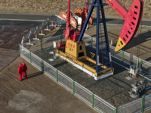 (251205) -- DAQING, Dec. 5, 2025 (Xinhua) -- An aerial drone photo shows operators carrying out inspection work on oil production equipment at a national-level demonstration zone of continental shale oil of Daqing Oilfield in Daqing, northeast China's Heilongjiang Province, Dec. 4, 2025. Daqing Oilfield, one of China's largest energy production bases, announced Friday that the yearly output of the shale oil in the demonstration zone has exceeded one million tonnes. (Xinhua/Wang Song)