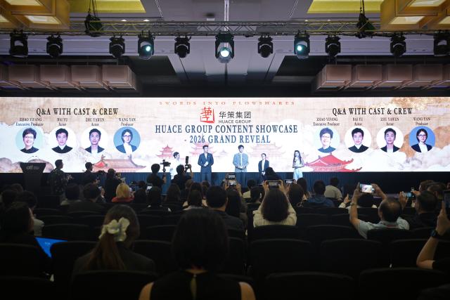 (251205) -- SINGAPORE, Dec. 5, 2025 (Xinhua) -- This photo taken on Dec. 4, 2025 shows a scene of a promotion event of Swords into Plowshares, a historical drama produced by Huace Group, during the 26th Asia TV Forum and Market in Singapore. TO GO WITH "Feature: Episodes that travel: how Chinese dramas speak universally" (Photo by Then Chih Wey/Xinhua)