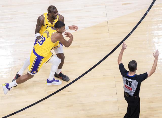 (251205) -- TORONTO, Dec. 5, 2025 (Xinhua) -- Rui Hachimura (Front L) of Los Angeles Lakers celebrates hitting a game-winning three-pointer during the 2025-2026 NBA regular season game between Toronto Raptors and Los Angeles Lakers in Toronto, Canada, on Dec. 4, 2025. (Photo by Zou Zheng/Xinhua)