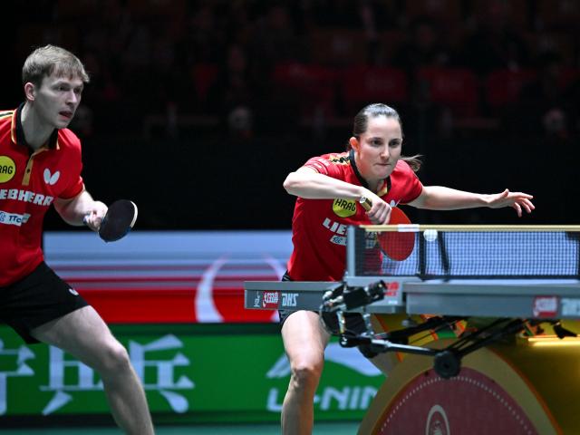 (251205) -- CHENGDU, Dec. 5, 2025 (Xinhua) -- Sabine Winter (R)/Benedikt Duda of Germany compete in the mixed doubles match against Kuai Man/Lin Shidong of China during the stage 2 group match between China and Germany at the ITTF Mixed Team World Cup 2025 in Chengdu, southwest China's Sichuan Province, Dec. 5, 2025. (Xinhua/Xu Bingjie)