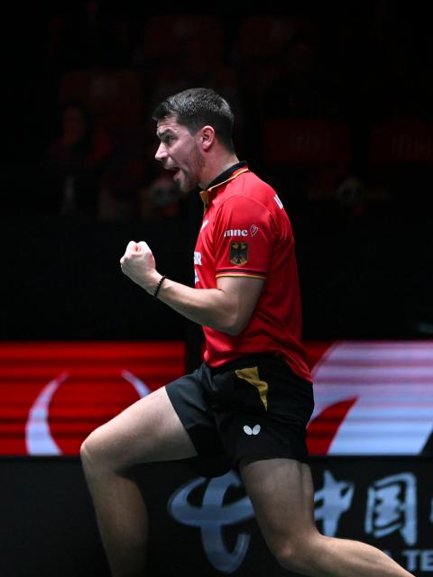 (251205) -- CHENGDU, Dec. 5, 2025 (Xinhua) -- Patrick Franziska of Germany celebrates in the men's singles match against Wang Chuqin of China during the stage 2 group match between China and Germany at the ITTF Mixed Team World Cup 2025 in Chengdu, southwest China's Sichuan Province, Dec. 5, 2025. (Xinhua/Xu Bingjie)