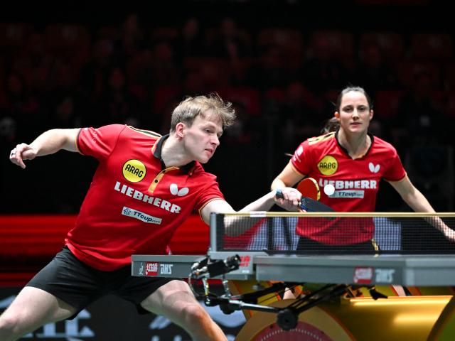 (251205) -- CHENGDU, Dec. 5, 2025 (Xinhua) -- Sabine Winter/Benedikt Duda (L) of Germany compete in the mixed doubles match against Kuai Man/Lin Shidong of China during the stage 2 group match between China and Germany at the ITTF Mixed Team World Cup 2025 in Chengdu, southwest China's Sichuan Province, Dec. 5, 2025. (Xinhua/Xu Bingjie)