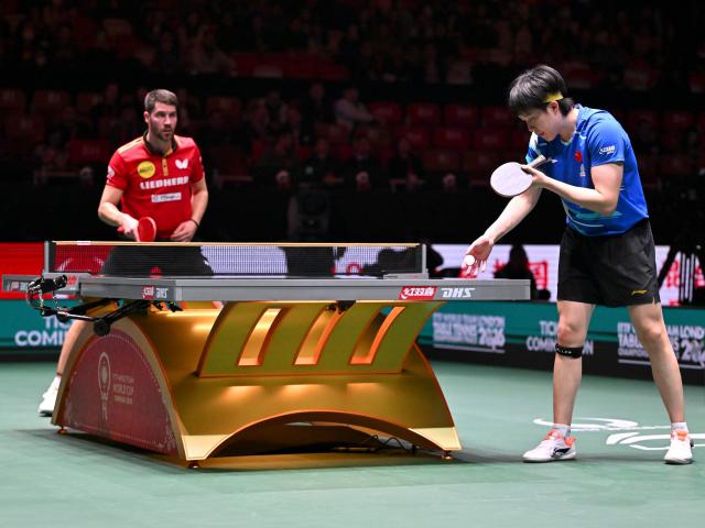 (251205) -- CHENGDU, Dec. 5, 2025 (Xinhua) -- Wang Chuqin (R) of China competes in the men's singles match against Patrick Franziska of Germany during the stage 2 group match between China and Germany at the ITTF Mixed Team World Cup 2025 in Chengdu, southwest China's Sichuan Province, Dec. 5, 2025. (Xinhua/Xu Bingjie)