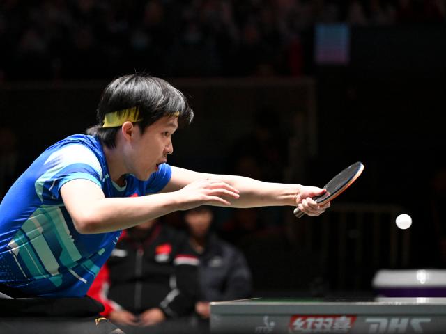 (251205) -- CHENGDU, Dec. 5, 2025 (Xinhua) -- Wang Chuqin of China competes in the men's singles match against Patrick Franziska of Germany during the stage 2 group match between China and Germany at the ITTF Mixed Team World Cup 2025 in Chengdu, southwest China's Sichuan Province, Dec. 5, 2025. (Xinhua/Xu Bingjie)
