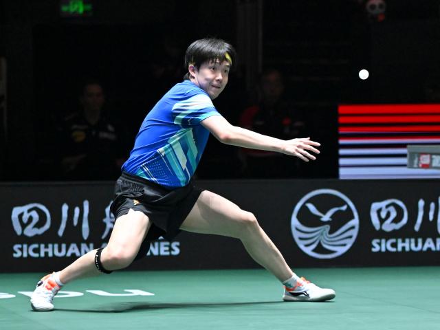 (251205) -- CHENGDU, Dec. 5, 2025 (Xinhua) -- Wang Chuqin of China competes in the men's singles match against Patrick Franziska of Germany during the stage 2 group match between China and Germany at the ITTF Mixed Team World Cup 2025 in Chengdu, southwest China's Sichuan Province, Dec. 5, 2025. (Xinhua/Xu Bingjie)