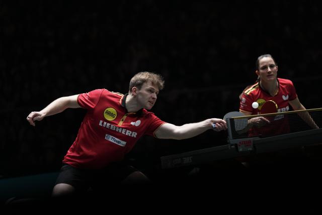 (251205) -- CHENGDU, Dec. 5, 2025 (Xinhua) -- Sabine Winter/Benedikt Duda (L) of Germany compete in the mixed doubles match against Kuai Man/Lin Shidong of China during the stage 2 group match between China and Germany at the ITTF Mixed Team World Cup 2025 in Chengdu, southwest China's Sichuan Province, Dec. 5, 2025. (Xinhua/Wang Ying)