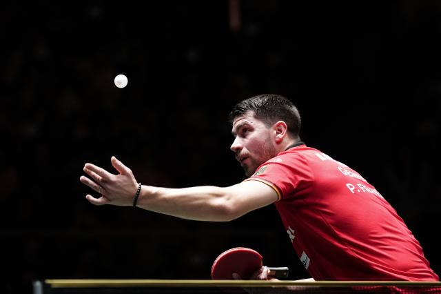 (251205) -- CHENGDU, Dec. 5, 2025 (Xinhua) -- Patrick Franziska of Germany serves in the men's singles match against Wang Chuqin of China during the stage 2 group match between China and Germany at the ITTF Mixed Team World Cup 2025 in Chengdu, southwest China's Sichuan Province, Dec. 5, 2025. (Xinhua/Wang Ying)