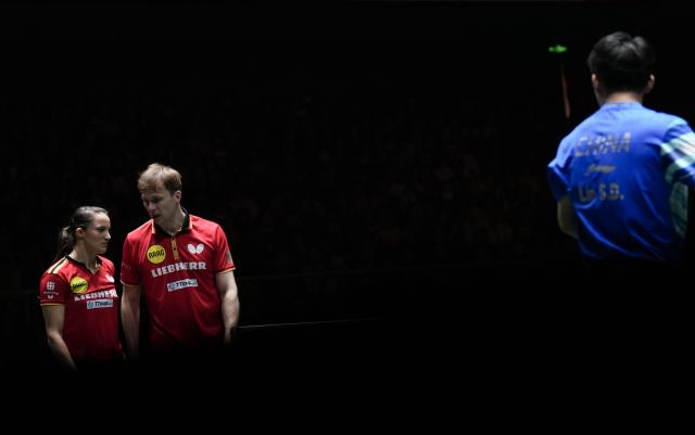 (251205) -- CHENGDU, Dec. 5, 2025 (Xinhua) -- Sabine Winter (L)/Benedikt Duda of Germany react in the mixed doubles match against Kuai Man/Lin Shidong of China during the stage 2 group match between China and Germany at the ITTF Mixed Team World Cup 2025 in Chengdu, southwest China's Sichuan Province, Dec. 5, 2025. (Xinhua/Wang Ying)
