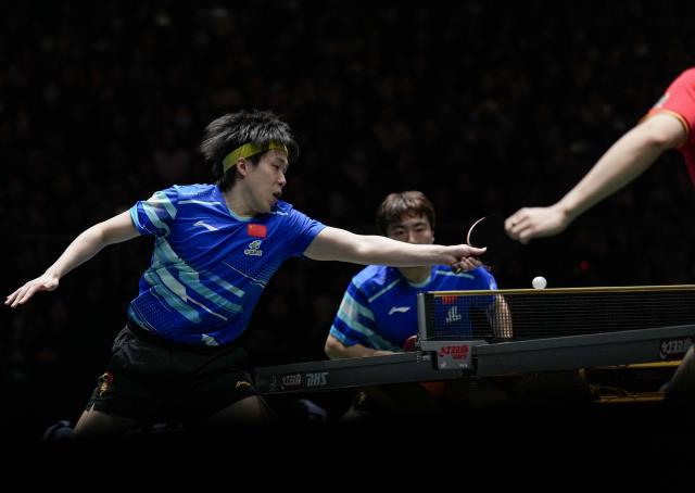 (251205) -- CHENGDU, Dec. 5, 2025 (Xinhua) -- Wang Chuqin (L)/Liang Jingkun of China compete in the men's doubles match against Benedikt Duda/Qiu Dang of Germany during the stage 2 group match between China and Germany at the ITTF Mixed Team World Cup 2025 in Chengdu, southwest China's Sichuan Province, Dec. 5, 2025. (Xinhua/Wang Ying)