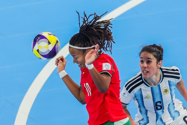 (251205) -- PASIG CITY, Dec. 5, 2025 (Xinhua) -- Maria Pereira (L) of Portugal competes during the semifinal match between Portugal and Argentina at the FIFA Futsal Women's World Cup 2025 in Pasig City, the Philippines, Dec. 5, 2025. (Xinhua/Rouelle Umali)