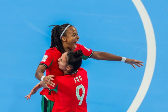 (251205) -- PASIG CITY, Dec. 5, 2025 (Xinhua) -- Players of Portugal celebrate after scoring a goal during the semifinal match between Portugal and Argentina at the FIFA Futsal Women's World Cup 2025 in Pasig City, the Philippines, Dec. 5, 2025. (Xinhua/Rouelle Umali)
