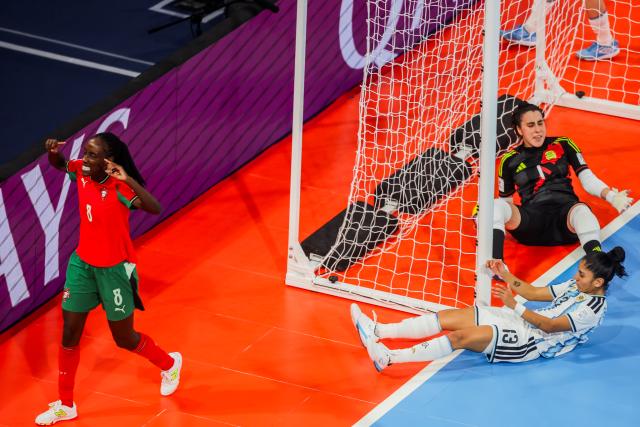 (251205) -- PASIG CITY, Dec. 5, 2025 (Xinhua) -- Janice Silva (L) of Portugal celebrates after scoring a goal during the semifinal match between Portugal and Argentina at the FIFA Futsal Women's World Cup 2025 in Pasig City, the Philippines, Dec. 5, 2025. (Xinhua/Rouelle Umali)