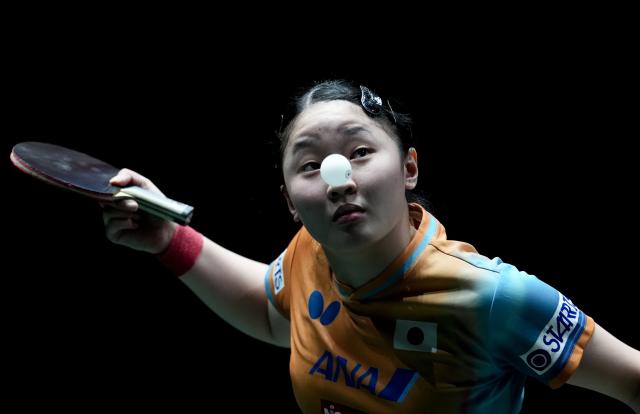 (251205) -- BEIJING, Dec. 5, 2025 (Xinhua) -- Harimoto Miwa of Japan competes in the women's singles match against Lee Eunhye of South Korea during the stage 2 group match between South Korea and Japan at the ITTF Mixed Team World Cup 2025 in Chengdu, southwest China's Sichuan Province, Dec. 5, 2025. (Xinhua/Wang Ying)