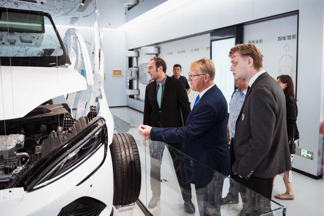 (251205) -- TIANJIN, Dec. 5, 2025 (Xinhua) -- Members of Central and Eastern Europe-China Science and Technology Exchange Association attend a special experience activity for new energy vehicles in Tianjin, north China, Sept. 14, 2025. TO GO WITH "China Focus: From tea sets to tech, China-chic captivates global consumers" (Xinhua)