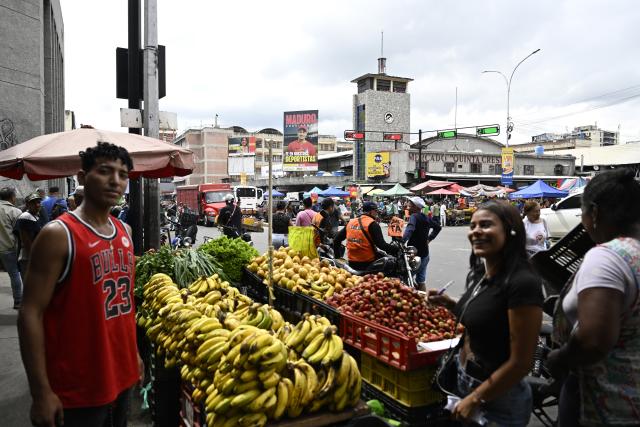 (251205) -- CARACAS, Dec. 5, 2025 (Xinhua) -- This photo taken on Dec. 5, 2025 shows a scene outside of the Quinta Crespo Market, which is one of the city's famous and traditional municipal markets, in Caracas, Venezuela. (Xinhua/Li Muzi)