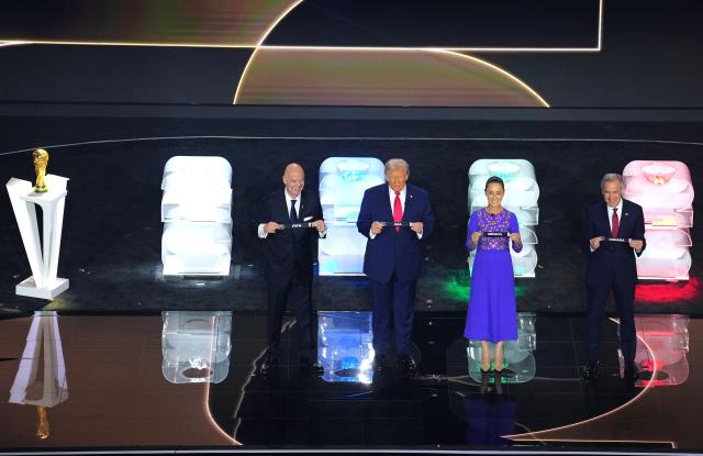 (251206) -- WASHINGTON D.C., Dec. 6, 2025 (Xinhua) -- FIFA President Giovanni Infantino, U.S. President Donald Trump, Mexican President Claudia Sheinbaum and Canadian Prime Minister Mark Carney (L-R) hold tickets during the FIFA World Cup 2026 Final Draw at the Kennedy Center in Washington D.C., the United States. (Xinhua/Wu Xiaoling)