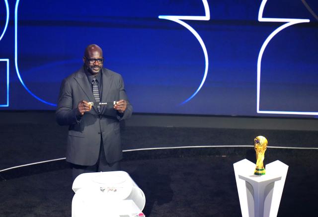 (251206) -- WASHINGTON D.C., Dec. 6, 2025 (Xinhua) -- Draw Assistant Shaquille O'Neal holds the ticket of Iran during the FIFA World Cup 2026 Final Draw at the Kennedy Center in Washington D.C., the United States. (Xinhua/Wu Xiaoling)