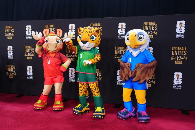 (251206) --  WASHINGTON D.C., Dec. 6, 2025 (Xinhua) -- The FIFA World Cup 2026 mascots, Maple the Moose of Canada, Zayu the Jaguar of Mexico and Clutch the Bald Eagle of the U.S.(L-R) arrive on the red carpet ahead of the FIFA World Cup 2026 Final Draw at the Kennedy Center in Washington D.C., the United States, Dec. 5, 2025. (Xinhua/Jia Haocheng)