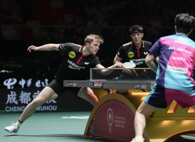 (251206) -- CHENGDU, Dec. 6, 2025 (Xinhua) -- Qiu Dang/Benedikt Duda (L) of Germany compete in the men's doubles match against Park Ganghyeon/An Jaehyun of South Korea during the stage 2 group match between Germany and South Korea at the ITTF Mixed Team World Cup 2025 in Chengdu, southwest China's Sichuan Province, Dec. 6, 2025. (Xinhua/Wang Ying)