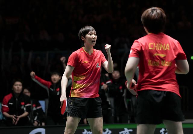 (251206) -- CHENGDU, Dec. 6, 2025 (Xinhua) -- Wang Manyu(L)/Kuai Man of China react during the women's doubles match against Harimoto Miwa/Satsuki Odo of Japan during the stage 2 group match between China and Japan at the ITTF Mixed Team World Cup 2025 in Chengdu, southwest China's Sichuan Province, Dec. 6, 2025. (Xinhua/Wang Ying)