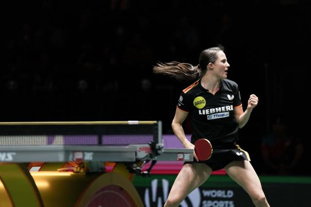 (251206) -- CHENGDU, Dec. 6, 2025 (Xinhua) -- Sabine Winter of Germany reacts in the women's singles match against Lee Eunhye of South Korea during the stage 2 group match between Germany and South Korea at the ITTF Mixed Team World Cup 2025 in Chengdu, southwest China's Sichuan Province, Dec. 6, 2025. (Xinhua/Wang Ying)