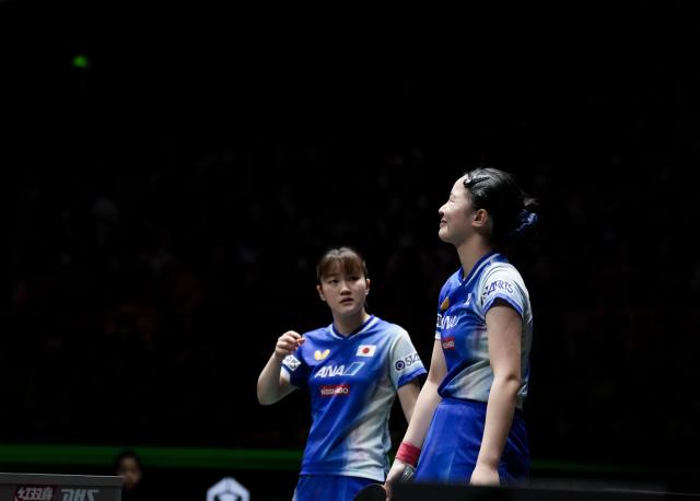 (251206) -- CHENGDU, Dec. 6, 2025 (Xinhua) -- Harimoto Miwa(R)/Satsuki Odo of Japan react during the women's doubles match against Wang Manyu/Kuai Man of China during the stage 2 group match between China and Japan at the ITTF Mixed Team World Cup 2025 in Chengdu, southwest China's Sichuan Province, Dec. 6, 2025. (Xinhua/Wang Ying)