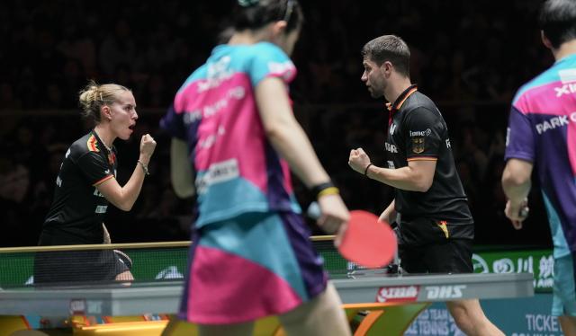 (251206) -- CHENGDU, Dec. 6, 2025 (Xinhua) -- Annett Kaufmann(1st L)/Patrick Franziska (3rd L) of Germany react in the mixed doubles match against Kim Nayeong/Park Ganghyeon of South Korea during the stage 2 group match between Germany and South Korea at the ITTF Mixed Team World Cup 2025 in Chengdu, southwest China's Sichuan Province, Dec. 6, 2025. (Xinhua/Wang Ying)