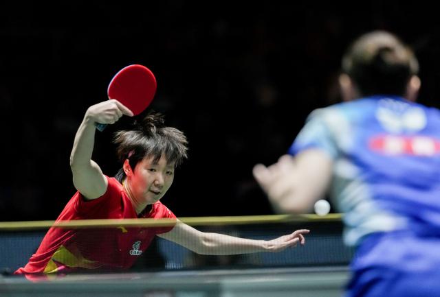 (251206) -- CHENGDU, Dec. 6, 2025 (Xinhua) -- Wang Manyu of China hits a return during the women's singles match against Ito Mima of Japan during the stage 2 group match between China and Japan at the ITTF Mixed Team World Cup 2025 in Chengdu, southwest China's Sichuan Province, Dec. 6, 2025. (Xinhua/Wang Ying)