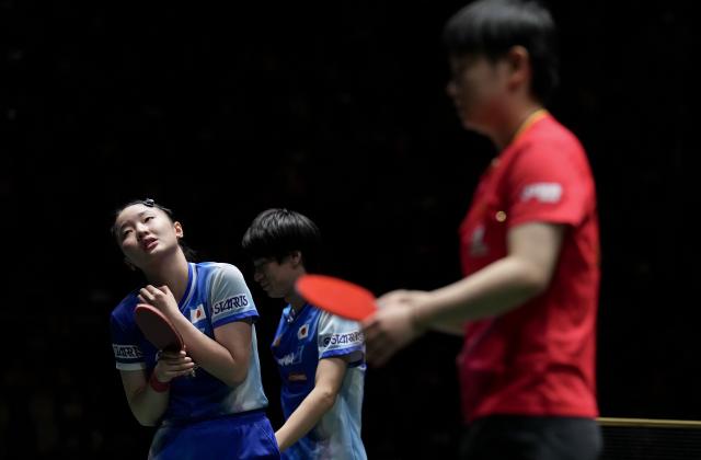 (251206) -- CHENGDU, Dec. 6, 2025 (Xinhua) -- Harimoto Miwa(L)/Togami Shunsuke of Japan react during the women's doubles match against Sun Yingsha/Wang Chuqin of China during the stage 2 group match between China and Japan at the ITTF Mixed Team World Cup 2025 in Chengdu, southwest China's Sichuan Province, Dec. 6, 2025. (Xinhua/Wang Ying)