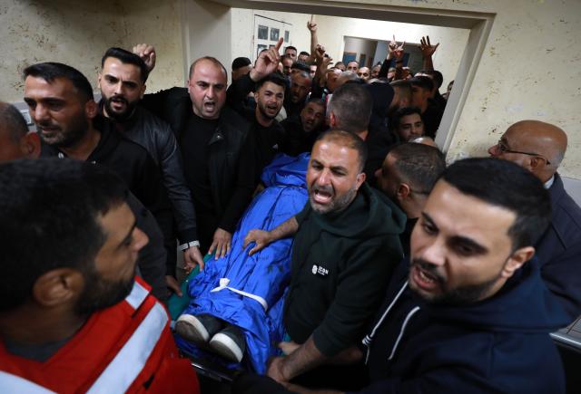 (251206) -- NABLUS, Dec. 6, 2025 (Xinhua) -- Relatives mourn over the Palestinian man Baha Abdel Rahman Rashed killed by the Israeli forces, at a hospital in the West Bank city of Nablus, on Dec. 5, 2025. The 38-year-old Baha Abdel Rahman Rashed, was shot dead by Israeli soldiers on Friday in the village of Odala, south of the city of Nablus in the northern West Bank, the Palestinian Ministry of Health said. (Photo by Ayman Nobani/Xinhua)