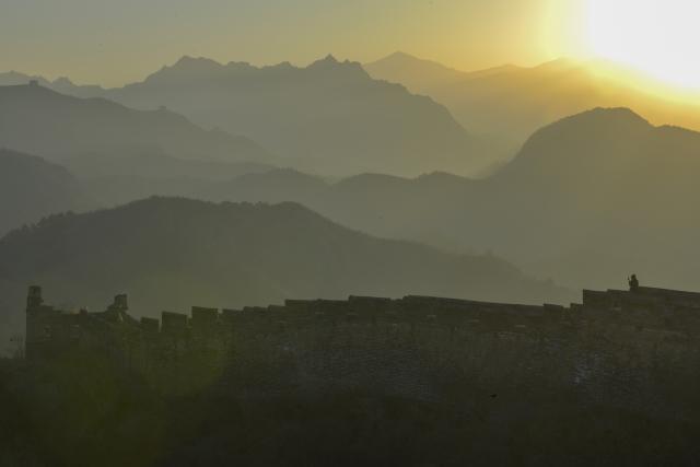 (251206) -- BEIJING, Dec. 6, 2025 (Xinhua) -- A visitor is seen on the Jinshanling section of the Great Wall in Luanping County, Chengde City of north China's Hebei Province, Dec. 6, 2025. (Photo by Zhou Wanping/Xinhua)