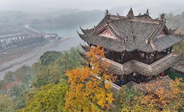 (251206) -- CHENGDU, Dec. 6, 2025 (Xinhua) -- An aerial drone photo taken on Dec. 6, 2025 shows the "fish-mouth" water diversion, looked over from Qinyanlou pavilion, at Dujiangyan scenic area in Chengdu, southwest China's Sichuan Province. The Dujiangyan irrigation system, characterized by dam-free water diversion, was built in 256 BC and is the oldest, the only remaining grand water conservancy project in the world, which has withstood the tests of natural disasters such as floods and earthquakes, and is still in use today. 
   A "fish-mouth" shaped weir splits the Minjiang River into an inner channel for irrigation and an outer channel for discharge of flood water. 
   It was listed as a World Cultural Heritage by the United Nations in November 2000, and was listed as a World Irrigation Engineering Heritage in August 2018. (Xinhua/Liu Kun)