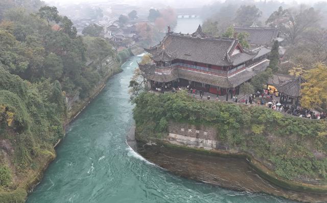 (251206) -- CHENGDU, Dec. 6, 2025 (Xinhua) -- An aerial drone photo taken on Dec. 6, 2025 shows Baopingkou, an artificially excavated water inlet, at Dujiangyan scenic area in Chengdu, southwest China's Sichuan Province. The Dujiangyan irrigation system, characterized by dam-free water diversion, was built in 256 BC and is the oldest, the only remaining grand water conservancy project in the world, which has withstood the tests of natural disasters such as floods and earthquakes, and is still in use today. 
   A "fish-mouth" shaped weir splits the Minjiang River into an inner channel for irrigation and an outer channel for discharge of flood water. 
   It was listed as a World Cultural Heritage by the United Nations in November 2000, and was listed as a World Irrigation Engineering Heritage in August 2018. (Xinhua/Liu Kun)
