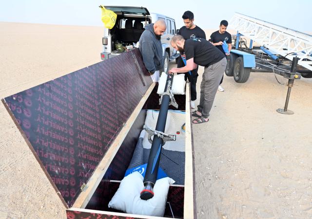 (251207) -- JAHRA GOVERNORATE, Dec. 7, 2025 (Xinhua) -- Members of the Kuwait Space Rocket Team prepare for the launch of the rocket "Tamouh-3" in Jahra Governorate, Kuwait, Dec. 6, 2025. The Kuwait Space Rocket team said a small rocket it attempted to launch on Saturday morning exploded shortly after ignition in Jahra Governorate, with no injuries reported.
   The rocket, named "Tamouh-3," was approximately 3.2 meters long with a maximum thrust of around 12,000 newtons. It was equipped with GPS devices designed to record coordinates, speed, altitude, acceleration, and other flight data.
   According to the team, this was its fourth launch attempt. It said it will investigate the cause of the explosion while continuing its development efforts. (Photo by Asad/Xinhua)