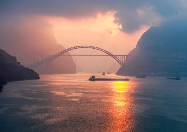 (251207) -- BEIJING, Dec. 7, 2025 (Xinhua) -- Ships sail on the Yangtze River near the Xiling Gorge in Zigui County, central China's Hubei Province, Dec. 6, 2025. (Photo by Wang Gang/Xinhua)