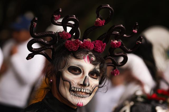 (251207) -- MEXICO CITY, Dec. 7, 2025 (Xinhua) -- A costumed performer is pictured during the Villa-Zapata carnival in Mexico City, Mexico, on Dec. 6, 2025. The 11th Villa-Zapata carnival was hosted in Mexico City on Saturday. Folkloric dances, traditional music, and street processions were seen along the Paseo de la Reforma avenue during the event, promoting traditional Mexican culture while paying tribute to revolutionary leaders Emiliano Zapata and Francisco Villa in the Mexican Revolution of 1910-1920. (Photo by Francisco Canedo/Xinhua)