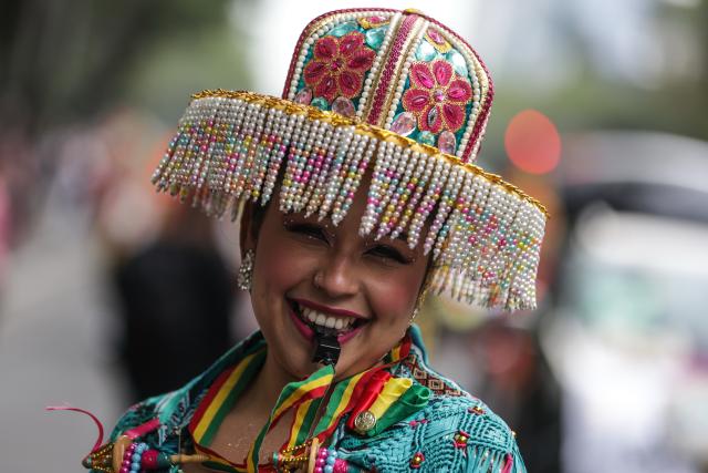 (251207) -- MEXICO CITY, Dec. 7, 2025 (Xinhua) -- A costumed performer is pictured during the Villa-Zapata carnival in Mexico City, Mexico, on Dec. 6, 2025. The 11th Villa-Zapata carnival was hosted in Mexico City on Saturday. Folkloric dances, traditional music, and street processions were seen along the Paseo de la Reforma avenue during the event, promoting traditional Mexican culture while paying tribute to revolutionary leaders Emiliano Zapata and Francisco Villa in the Mexican Revolution of 1910-1920. (Photo by Francisco Canedo/Xinhua)