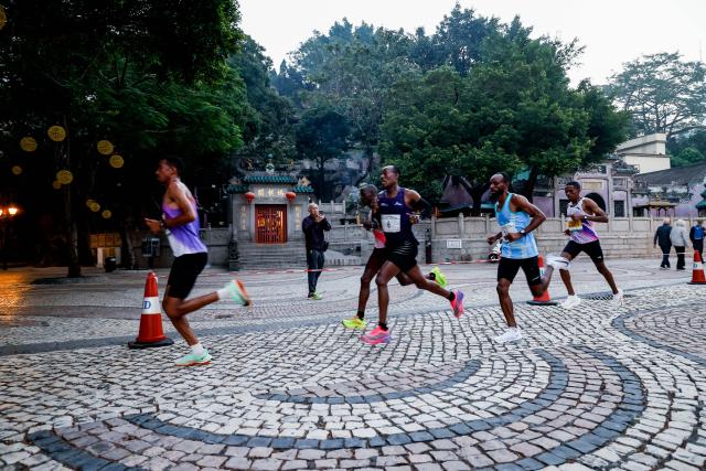 (251207) -- MACAO, Dec. 7, 2025 (Xinhua) -- Competitors run during the Macao International Marathon 2025 in Macao, South China, Dec. 7, 2025. (Xinhua)