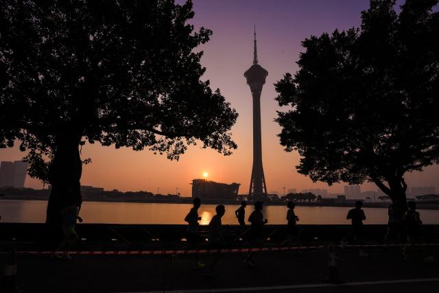 (251207) -- MACAO, Dec. 7, 2025 (Xinhua) -- Competitors run during the Macao International Marathon 2025 in Macao, South China, Dec. 7, 2025. (Xinhua)