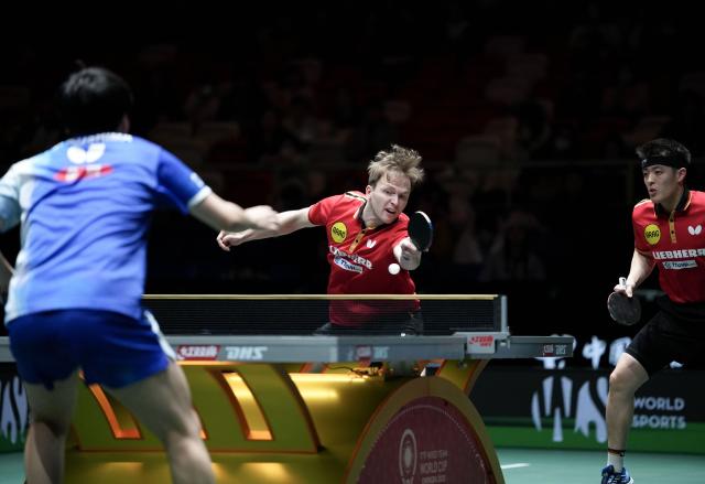 (251207) -- CHENGDU, Dec. 7, 2025 (Xinhua) -- Qiu Dang/Benedikt Duda (C) of Germany compete with Matsushima Sora/Togami Shunsuke of Japan during the men's doubles match of the semifinal between Japan and Germany at the ITTF Mixed Team World Cup 2025 in Chengdu, southwest China's Sichuan Province, Dec. 7, 2025. (Xinhua/Wang Ying)