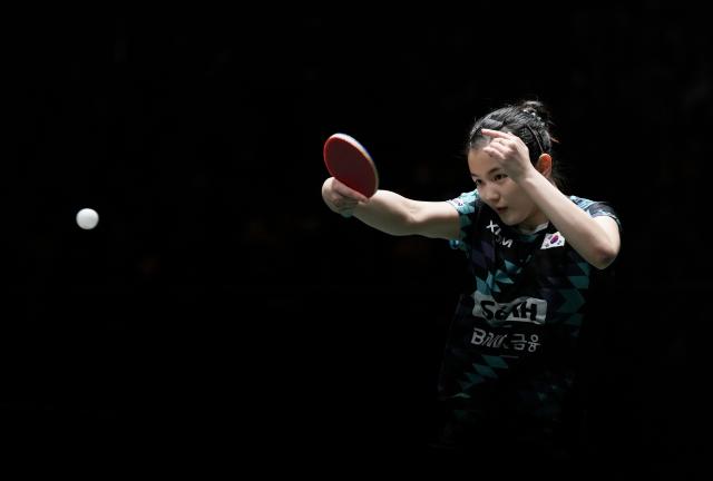 (251207) -- CHENGDU, Dec. 7, 2025 (Xinhua) -- Kim Nayeong of South Korea hits a return during the women's singles match against Kuai Man of China during the semifinal match between China and South Korea at the ITTF Mixed Team World Cup 2025 in Chengdu, southwest China's Sichuan Province, Dec. 7, 2025. (Xinhua/Wang Ying)