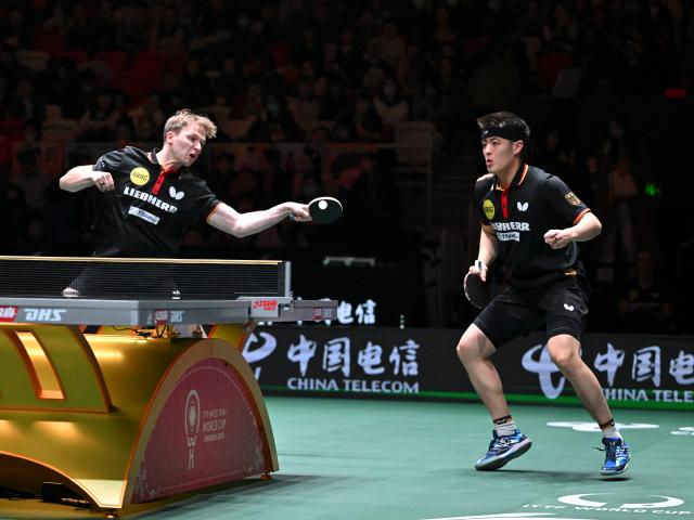 (251207) -- CHENGDU, Dec. 7, 2025 (Xinhua) -- Benedikt Duda (L)/Qiu Dang of Germany compete in the men's doubles match against Park Ganghyeon/Oh Junsung of South Korea during the bronze medal match between South Korea and Germany at the ITTF Mixed Team World Cup 2025 in Chengdu, southwest China's Sichuan Province, Dec. 7, 2025. (Xinhua/Xu Bingjie)