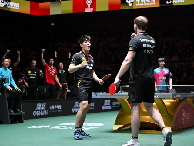 (251207) -- CHENGDU, Dec. 7, 2025 (Xinhua) -- Benedikt Duda/Qiu Dang (L) of Germany celebrate in the men's doubles match against Park Ganghyeon/Oh Junsung of South Korea during the bronze medal match between South Korea and Germany at the ITTF Mixed Team World Cup 2025 in Chengdu, southwest China's Sichuan Province, Dec. 7, 2025. (Xinhua/Xu Bingjie)