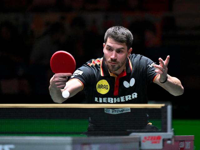 (251207) -- CHENGDU, Dec. 7, 2025 (Xinhua) -- Patrick Franziska of Germany competes in the men's singles match against Jang Woojin of South Korea during the bronze medal match between South Korea and Germany at the ITTF Mixed Team World Cup 2025 in Chengdu, southwest China's Sichuan Province, Dec. 7, 2025. (Xinhua/Xu Bingjie)