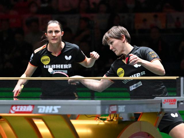 (251207) -- CHENGDU, Dec. 7, 2025 (Xinhua) -- Sabine Winter/Nina Mittelham (R) of Germany compete in the women's doubles match agaisnt Lee Eunhye/Choi Hyojoo of South Korea during the bronze medal match between South Korea and Germany at the ITTF Mixed Team World Cup 2025 in Chengdu, southwest China's Sichuan Province, Dec. 7, 2025. (Xinhua/Xu Bingjie)