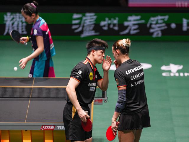 (251207) -- CHENGDU, Dec. 7, 2025 (Xinhua) -- Annett Kaufmann (R)/Qiu Dang of Germany talk with each other in the mixed doubles match against Kim Nayeong/Park Ganghyeon of South Korea during the bronze medal match between South Korea and Germany at the ITTF Mixed Team World Cup 2025 in Chengdu, southwest China's Sichuan Province, Dec. 7, 2025. (Xinhua/Wang Xi)
